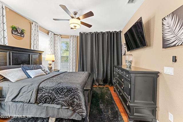 bedroom featuring ceiling fan and dark hardwood / wood-style flooring