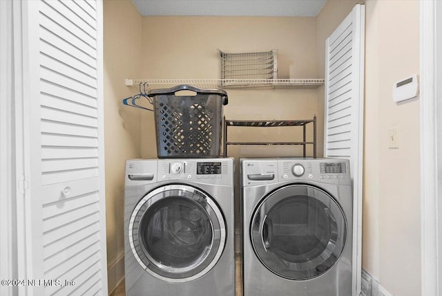 laundry room with separate washer and dryer