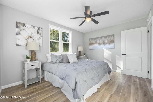 bedroom featuring ceiling fan and light wood-type flooring