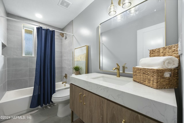 full bathroom with tile patterned floors, vanity, toilet, and shower / bathtub combination with curtain