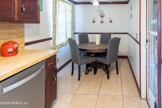 dining space featuring ceiling fan and light tile patterned floors