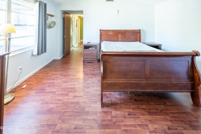 unfurnished bedroom featuring dark hardwood / wood-style floors