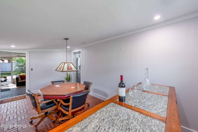 dining area with ornamental molding