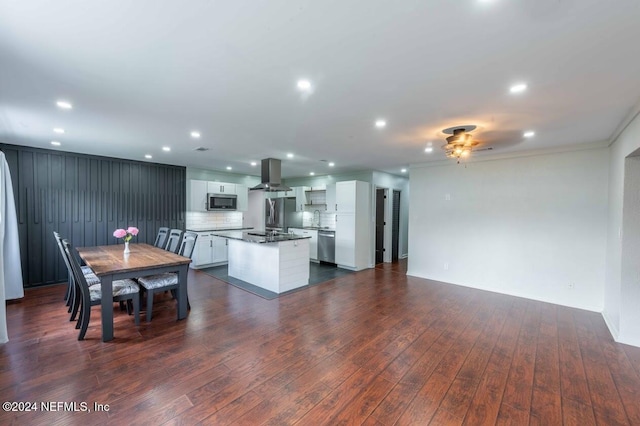 dining room featuring ornamental molding and dark hardwood / wood-style floors