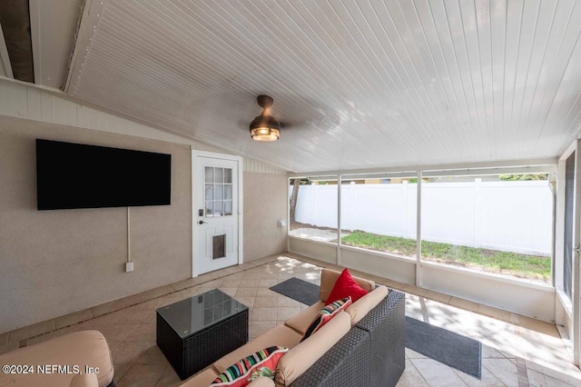 sunroom featuring lofted ceiling, a wealth of natural light, and wooden ceiling