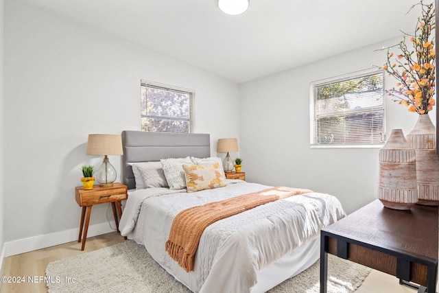 bedroom with light hardwood / wood-style floors