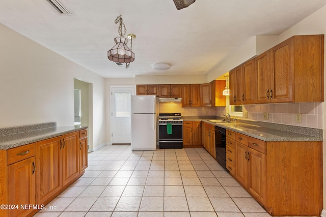 kitchen featuring sink, light tile patterned flooring, decorative light fixtures, and white appliances