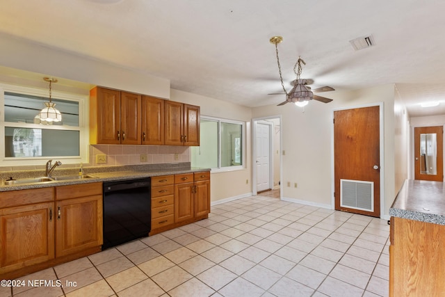 kitchen featuring dishwasher, sink, hanging light fixtures, ceiling fan, and light tile patterned flooring