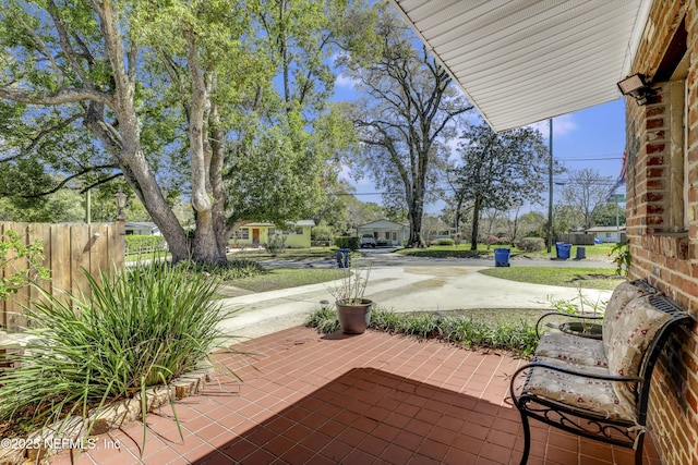 view of patio featuring fence