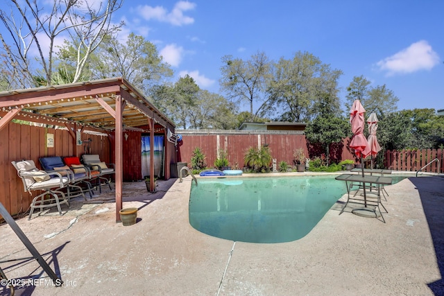 view of swimming pool featuring a patio area, a fenced in pool, and a fenced backyard