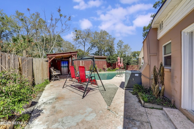 view of patio with a fenced in pool and a fenced backyard