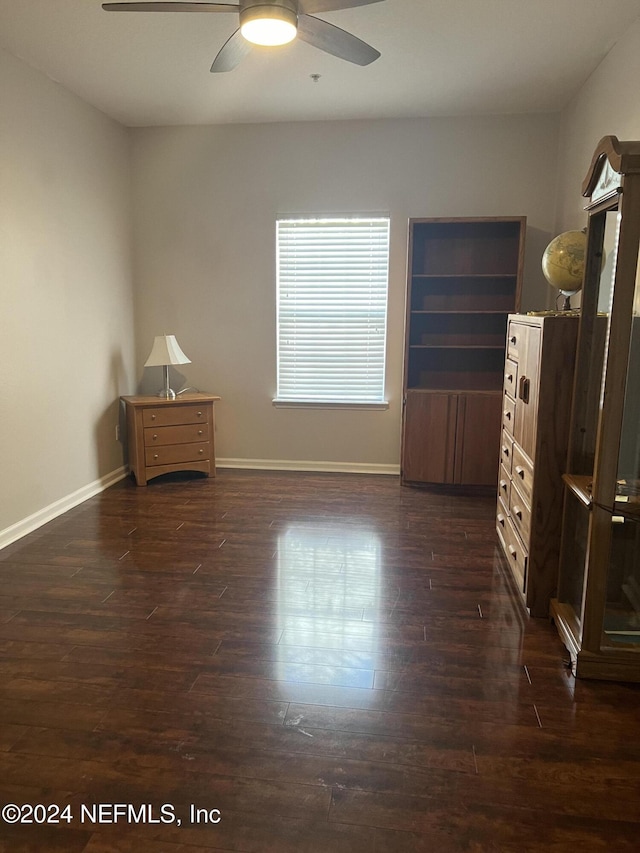 bedroom featuring dark hardwood / wood-style floors and ceiling fan