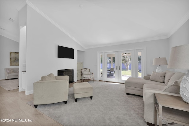 living room featuring crown molding, high vaulted ceiling, and french doors