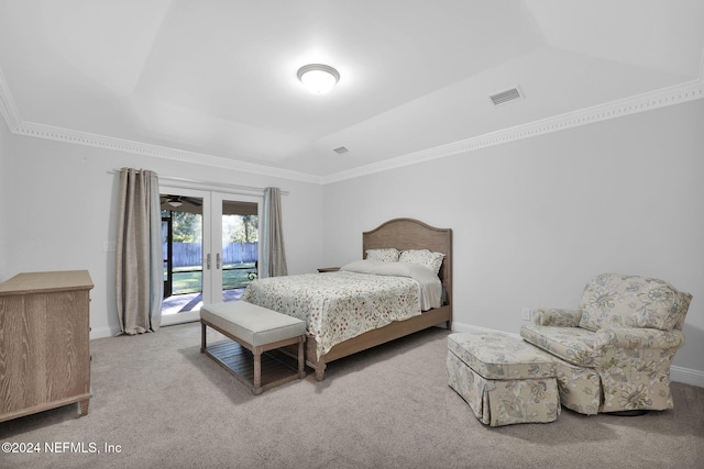 bedroom featuring french doors, access to outside, crown molding, and light colored carpet