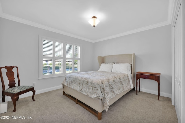 bedroom featuring crown molding and carpet floors