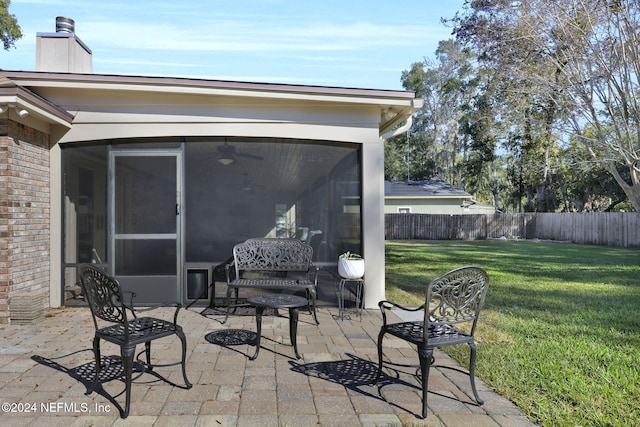 view of patio featuring a sunroom