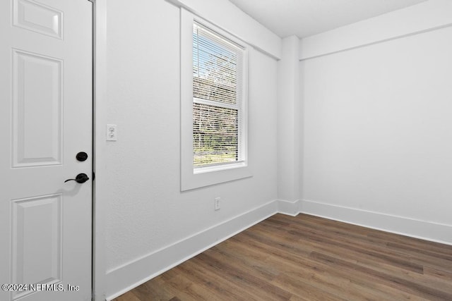 unfurnished room featuring hardwood / wood-style floors and a healthy amount of sunlight