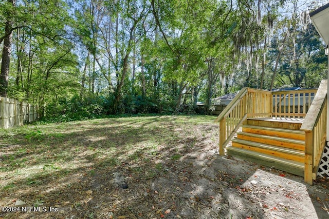 view of yard featuring a deck