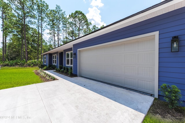 single story home with a front yard and a garage