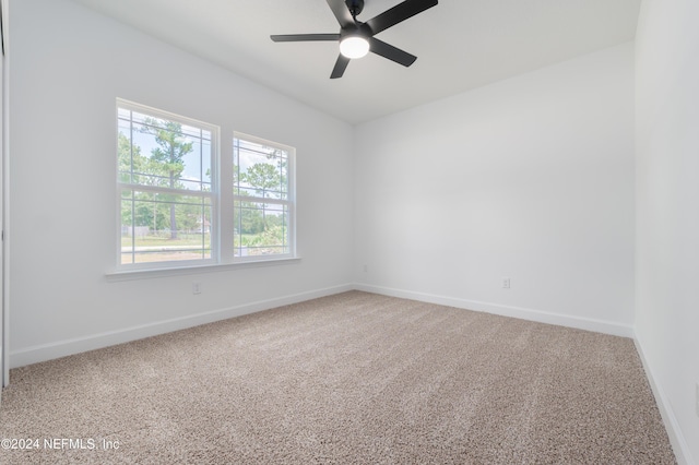 spare room with ceiling fan and carpet floors