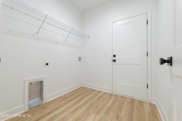 laundry room with hardwood / wood-style flooring, electric dryer hookup, and hookup for a washing machine