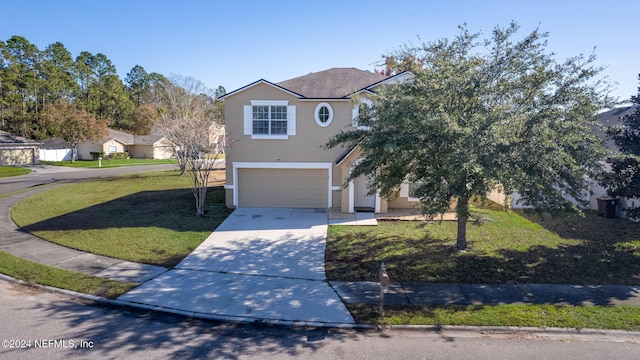 view of front facade with a garage and a front lawn