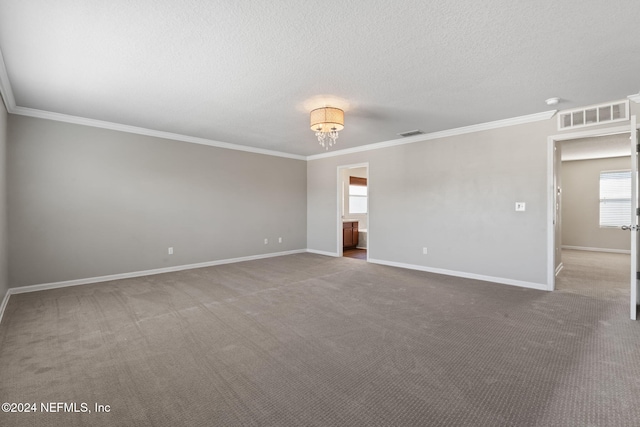 carpeted empty room featuring a textured ceiling, an inviting chandelier, and crown molding