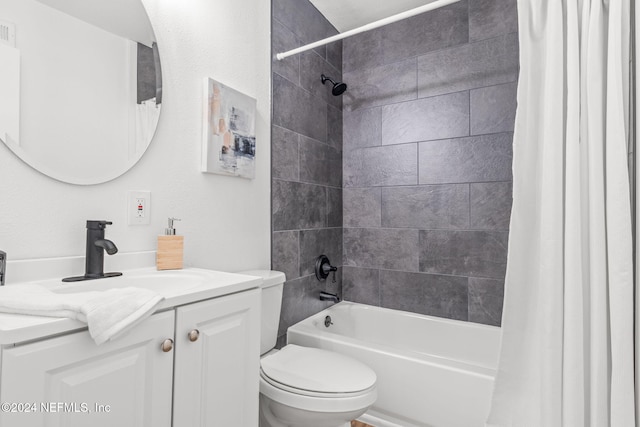 full bathroom featuring shower / bath combo, vanity, and toilet