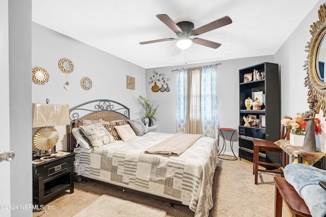 bedroom with ceiling fan and light colored carpet