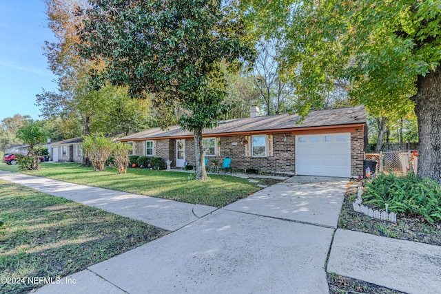 ranch-style house with a garage and a front yard