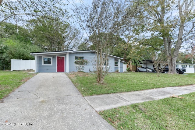 ranch-style house with a front lawn and a carport