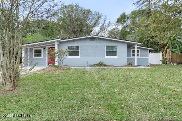 ranch-style house with a front lawn