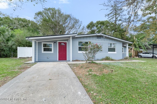 ranch-style house with a front lawn