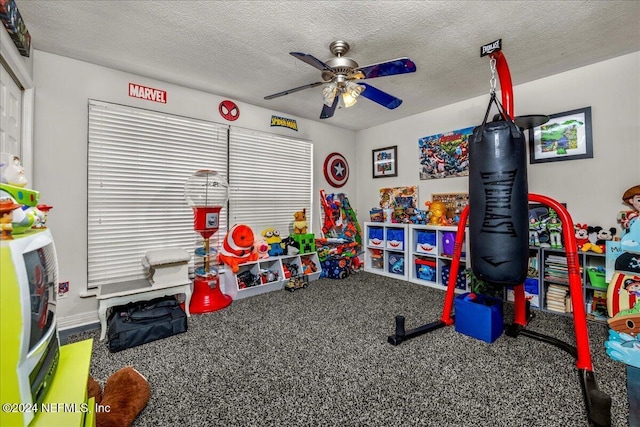 game room featuring a textured ceiling, carpet floors, and ceiling fan