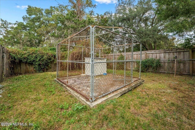 view of outbuilding featuring a lawn