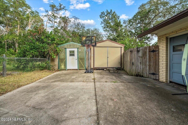 view of patio / terrace with a storage unit