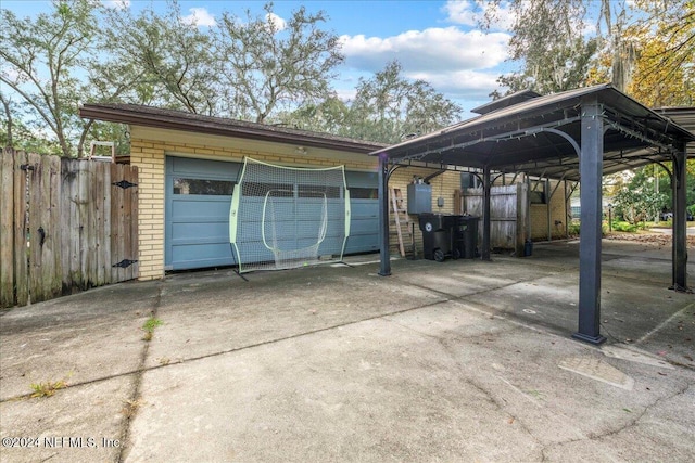 garage featuring a carport