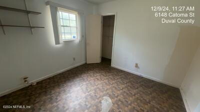 unfurnished bedroom featuring a closet