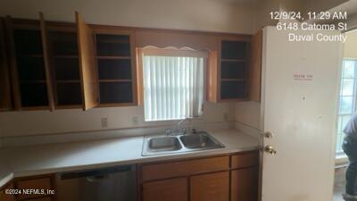 kitchen featuring dishwasher and sink