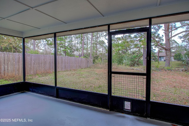 unfurnished sunroom with a healthy amount of sunlight and a paneled ceiling