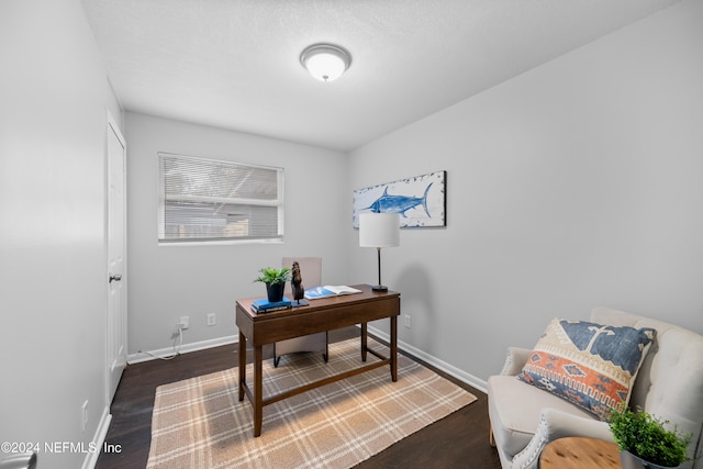 office with dark hardwood / wood-style floors