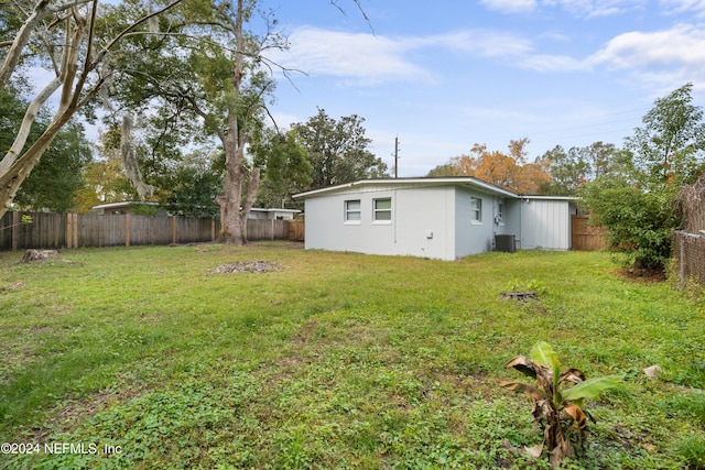 view of yard featuring central AC