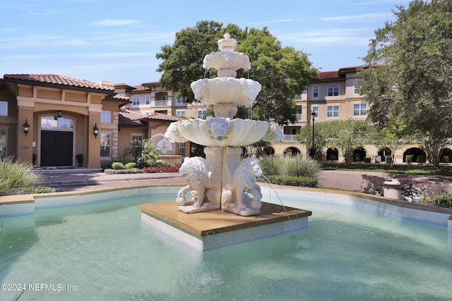 view of swimming pool featuring pool water feature