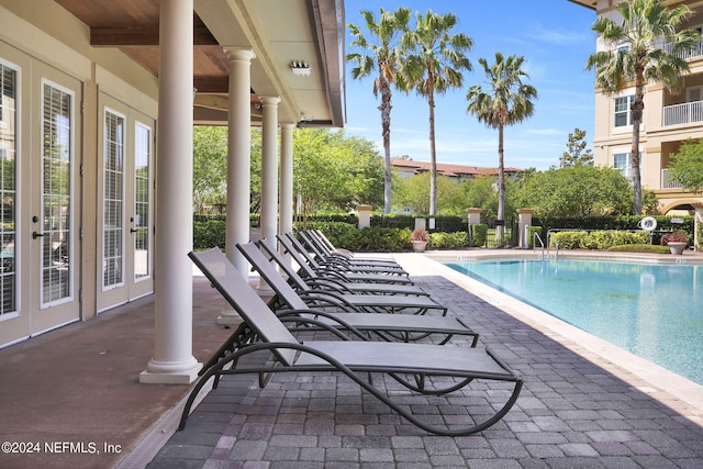 view of swimming pool with a patio area