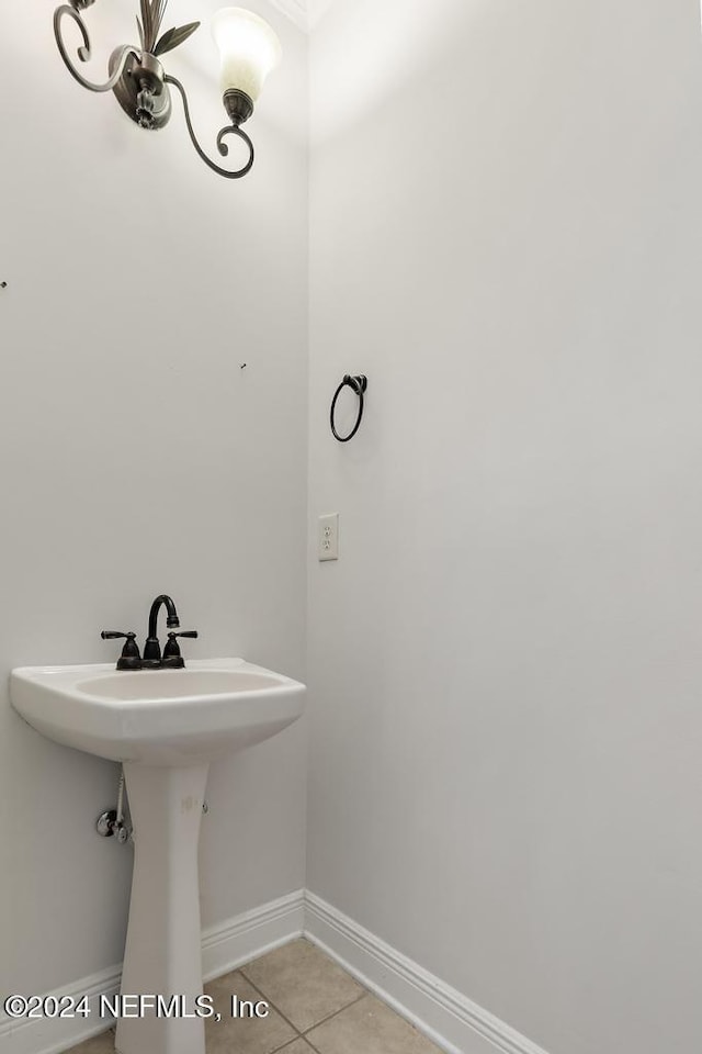 bathroom with tile patterned flooring and sink