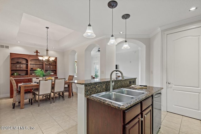 kitchen featuring stainless steel dishwasher, sink, decorative light fixtures, and ceiling fan with notable chandelier