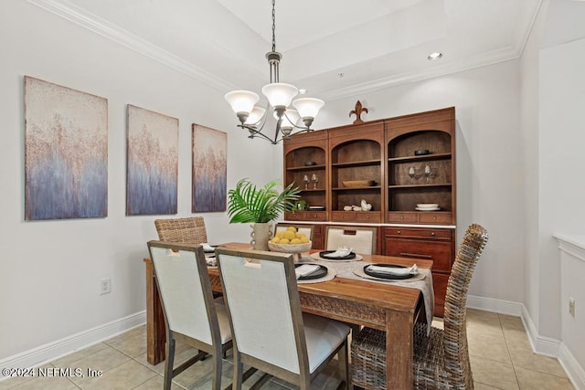 tiled dining space with a chandelier and ornamental molding