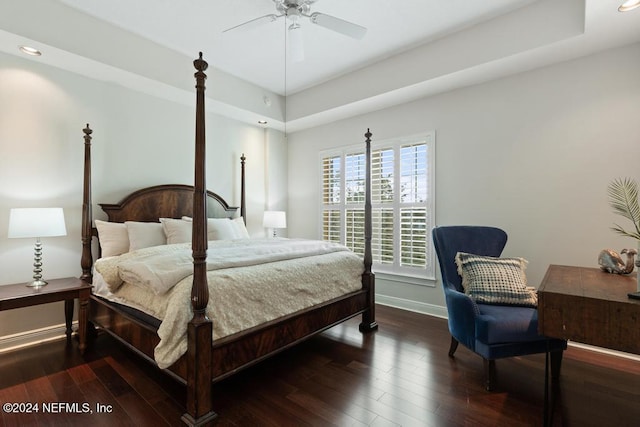 bedroom with ceiling fan and dark wood-type flooring