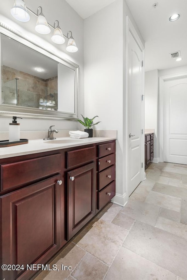 bathroom with vanity and an enclosed shower