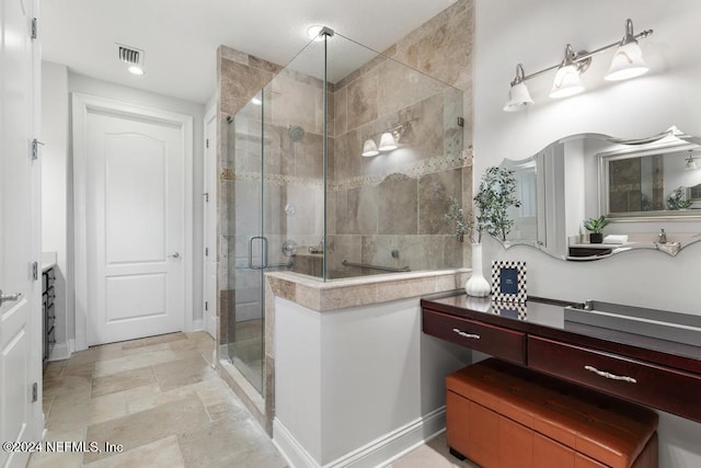 bathroom with vanity and an enclosed shower